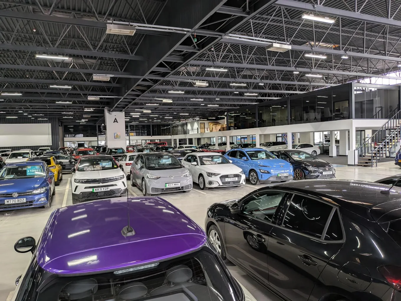 a large building with many cars